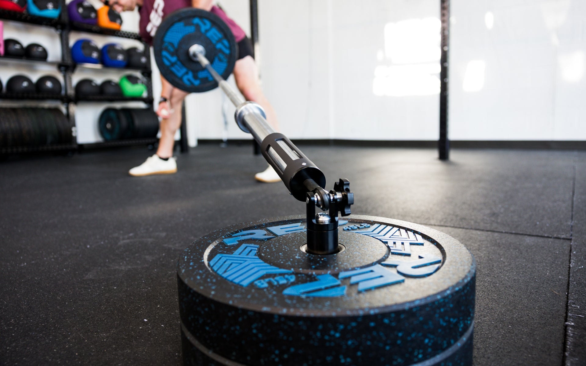 The Free Standing REP® x Kleva Built® Adroit Landmine being used by an athlete with REP's Pinnacle™ Plates
